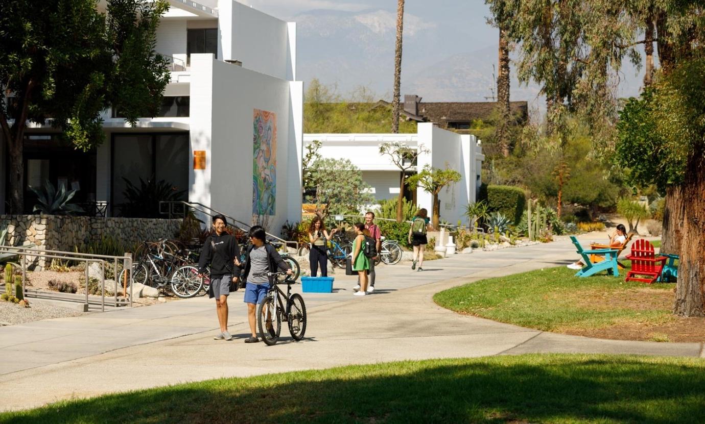 Students walk past the Mounds and Mead Hall.