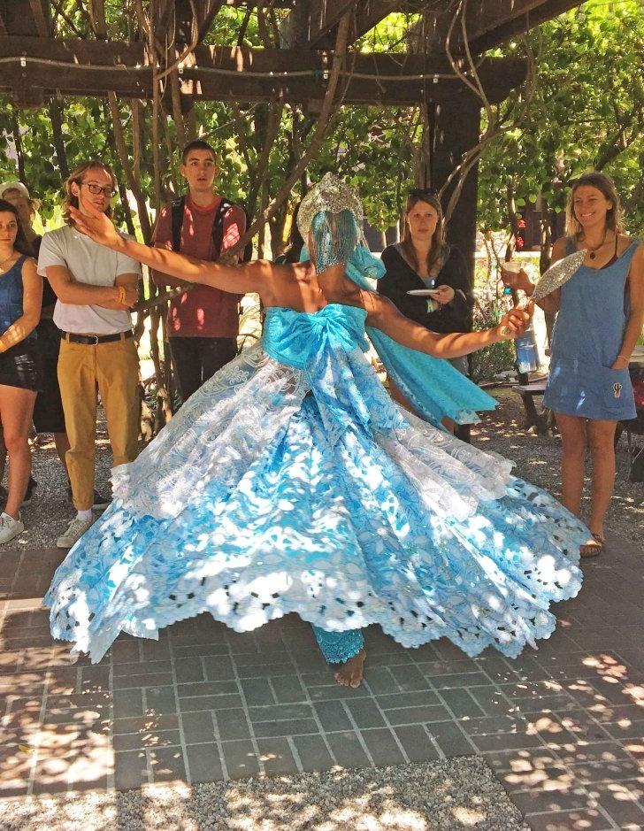 a brazilian dancer performs at the grove house's outdoor classroom space