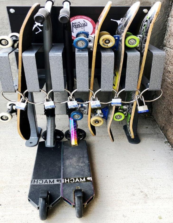 skateboards and scooters are placed on a dock